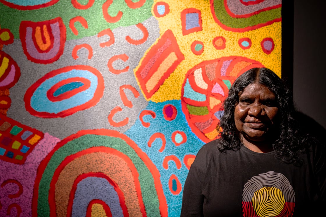 Maisie Ward in front of her artwork, Charismatic Photography, The Junction Co. (1)